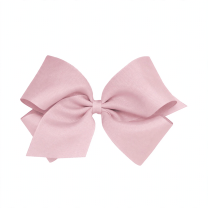 Large light pink grosgrain ribbon bow with two loops and two tails, tied neatly in the center.