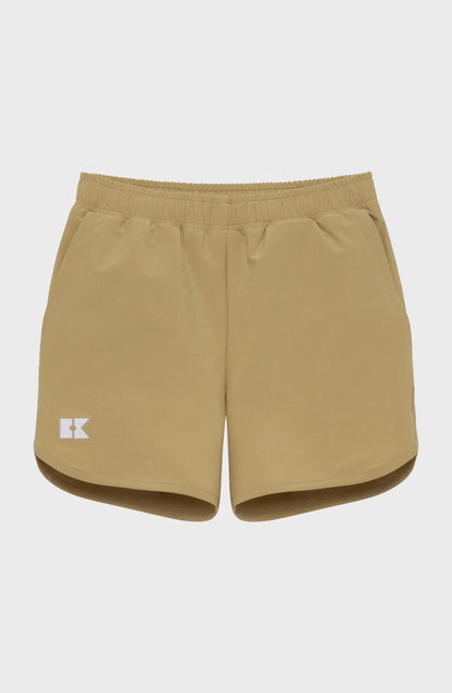 Khaki athletic shorts with an elastic waistband, side pockets, a white K logo on the left leg, and curved hems.