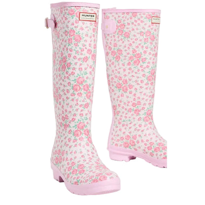 Hunter x LoveShackFancy women's tall rain boots with a pink and white floral rose pattern and adjustable back strap.