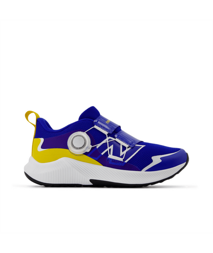 Children's royal blue and yellow athletic shoe with a white sole, black outsole, BOA dial, and hook-and-loop straps.