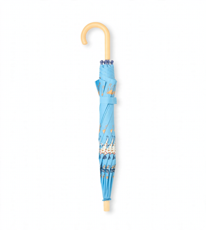Closed blue umbrella with dog print, wrist strap, and curved beige handle