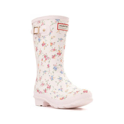 White Hunter x LoveShackFancy kids' rain boot with a delicate multi-colored floral print and a side buckle.