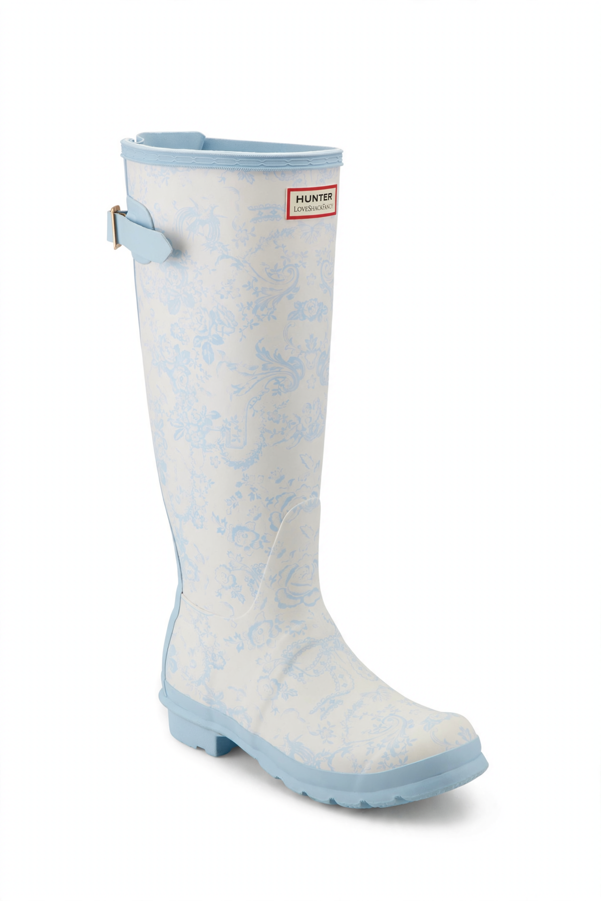 Tall white rain boot with light blue floral pattern, light blue trim, adjustable back buckle, and Hunter x LoveShackFancy logo.