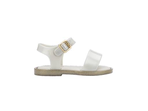 Mini Melissa Mar baby sandal in translucent white with a glittery gold sole and a gold buckle on the ankle strap.