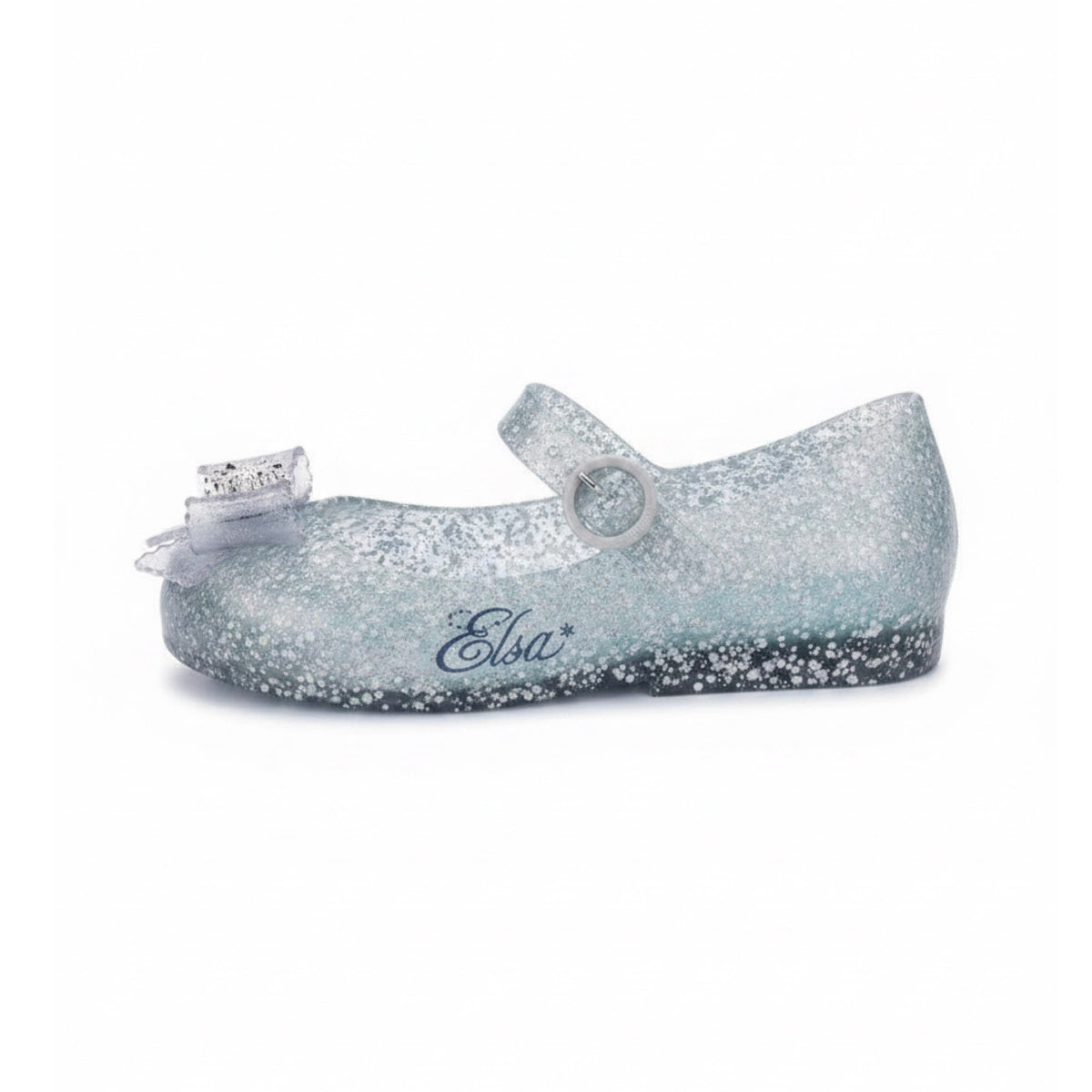 Glittery translucent light blue Mary Jane flat with a clear bow on the toe, a buckle strap, and 'Elsa*' written on the side.