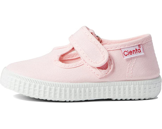 A light pink Cienta Classic T-Strap children's shoe with a white ribbed sole and a Velcro closure.