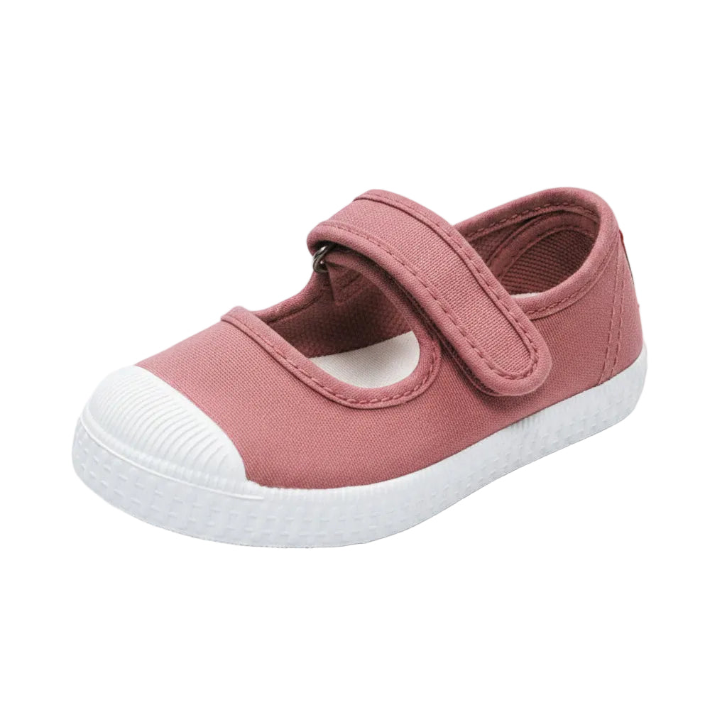 A single children's canvas shoe in dusty rose pink with a white rubber toe cap and sole, shown on a white background. 