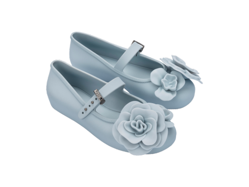 Pair of light blue children's ballerina flats with floral petal embellishments on the toe and an adjustable strap.
