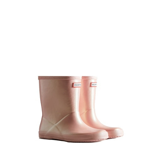 Pair of shimmery light pink Hunter Little Kids First Nebula rain boots with a short shaft and textured soles.