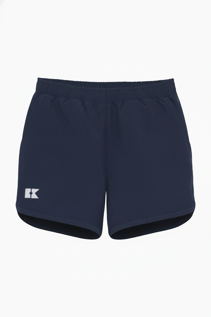 Navy blue athletic shorts with an elastic waistband, side pockets, a white logo on the left leg, and a curved hem.