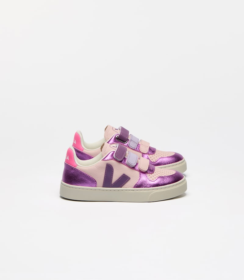 Pair of children's Veja V-10 leather sneakers in light pink and metallic purple with purple V-logo and three Velcro straps.
