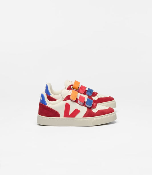 Pair of children's Veja V-10 sneakers in red and cream with blue and orange velcro straps and a red V logo.