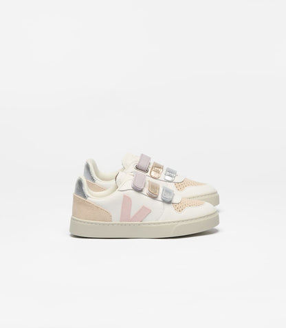 Pair of Veja Small V-10 children's sneakers in white with light pink V-logo, beige accents, and metallic silver, gold, and lavender velcro straps.