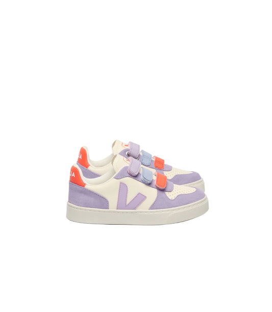 A pair of toddler sneakers in lavender purple, cream, and light blue, featuring two hook-and-loop straps with orange accents and a purple 'V' logo on the side, set against a plain white background.